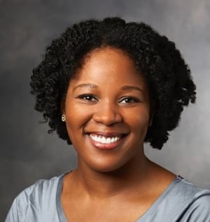 A person smiling for the camera

Description automatically generated with medium confidence